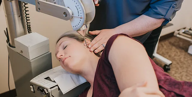 A women bring treated for Atlas Orthogonal pain.